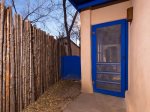 Brightly colored back door and side gate